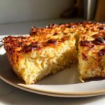 A thick slice of golden brown Leftover Spaghetti Frittata showing cooked spaghetti bound with egg and cheese.