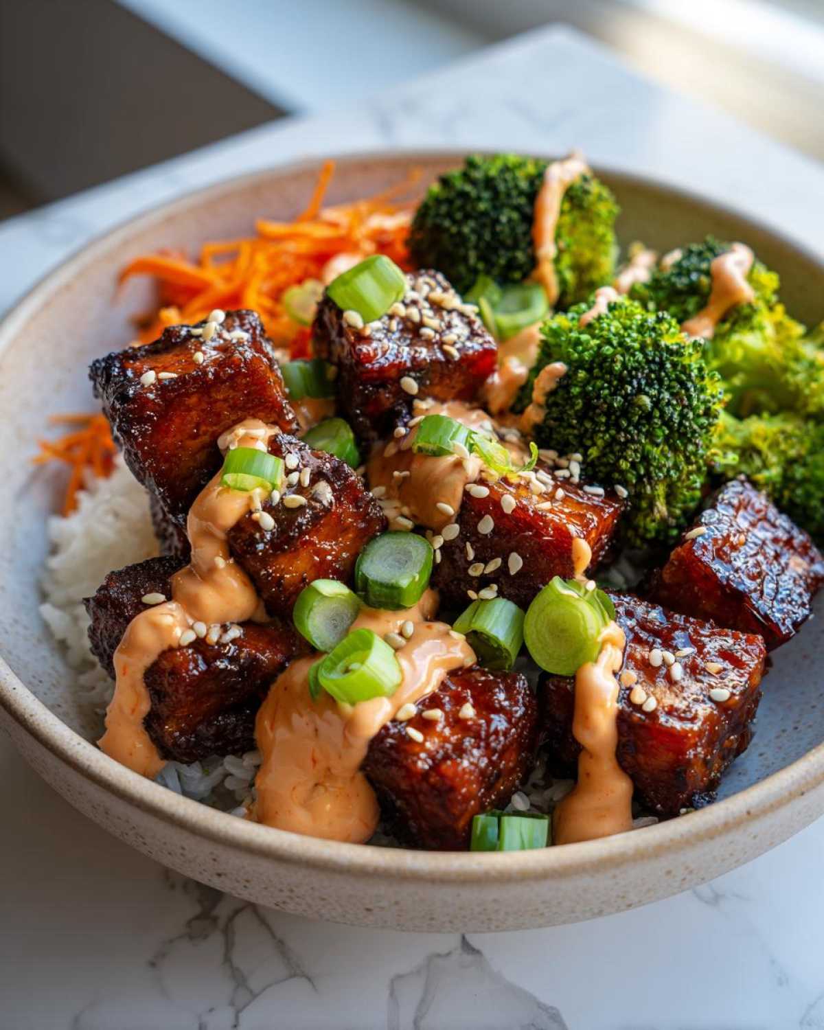 Close-up of Teriyaki Tofu Bowls featuring glazed tofu cubes, broccoli, and drizzled with Kimchi Mayo.